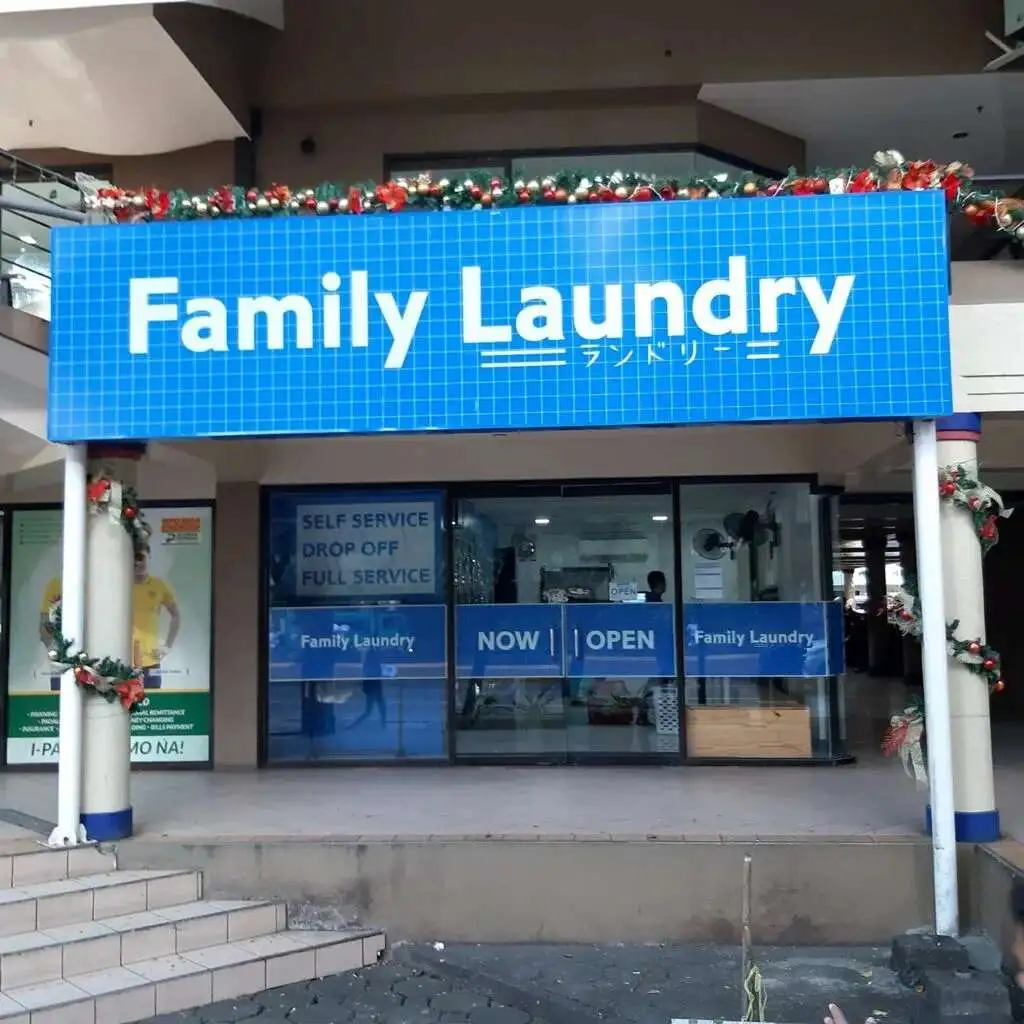 Facade of family laundry blue color paint.